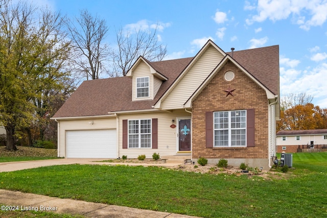 view of front of property featuring cooling unit, a front yard, and a garage