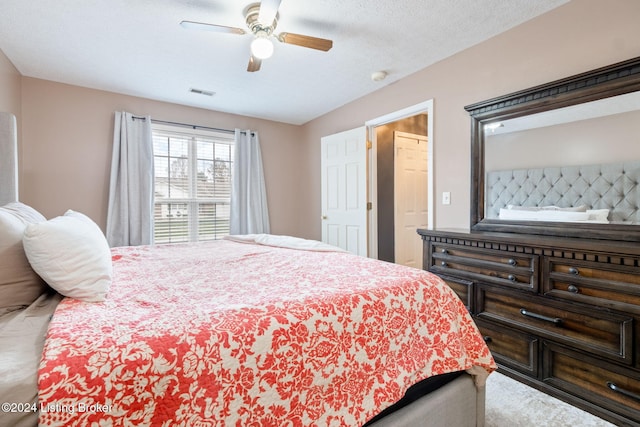 bedroom featuring a textured ceiling and ceiling fan