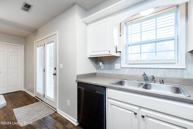 kitchen with white cabinetry, stainless steel dishwasher, dark wood-type flooring, and sink