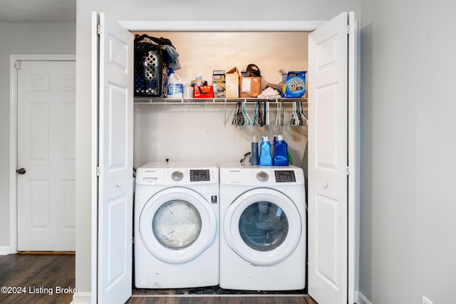 laundry room featuring separate washer and dryer and dark hardwood / wood-style flooring