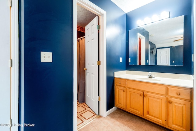 bathroom with vanity and a textured ceiling