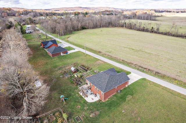 birds eye view of property with a rural view