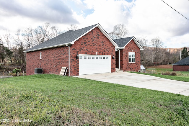 view of front of property with a front yard, a garage, and central air condition unit