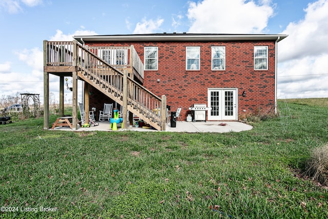 back of house with a patio area, a yard, and a deck