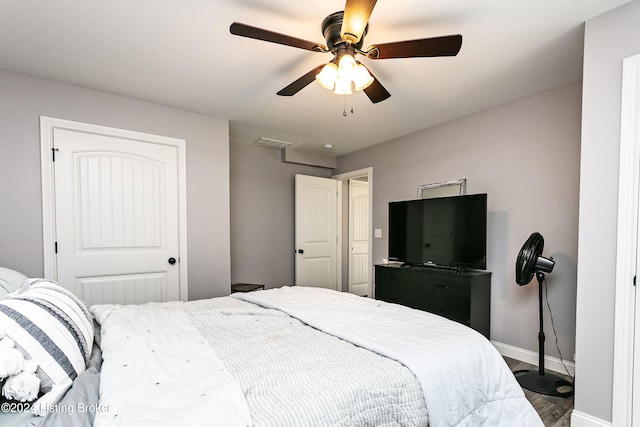 bedroom featuring ceiling fan and hardwood / wood-style flooring