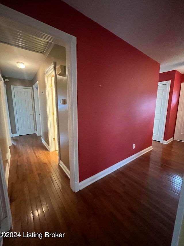 hall with wood-type flooring