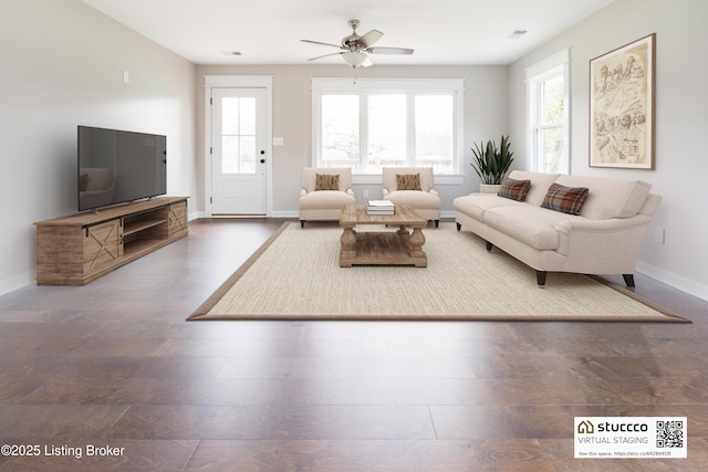 living room featuring ceiling fan and dark hardwood / wood-style flooring