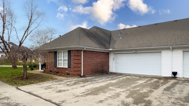 view of property exterior featuring a garage