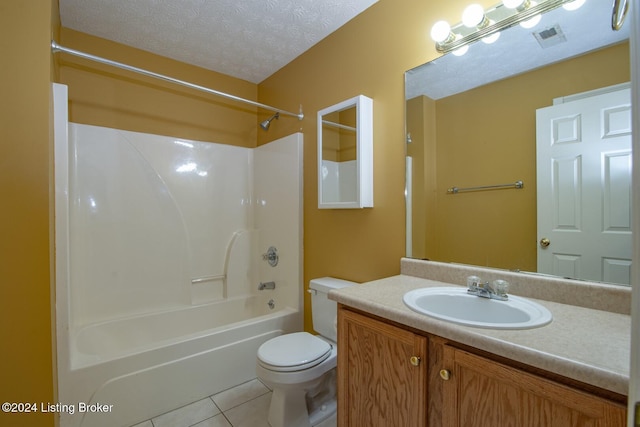 full bathroom featuring shower / bathing tub combination, vanity, tile patterned flooring, toilet, and a textured ceiling