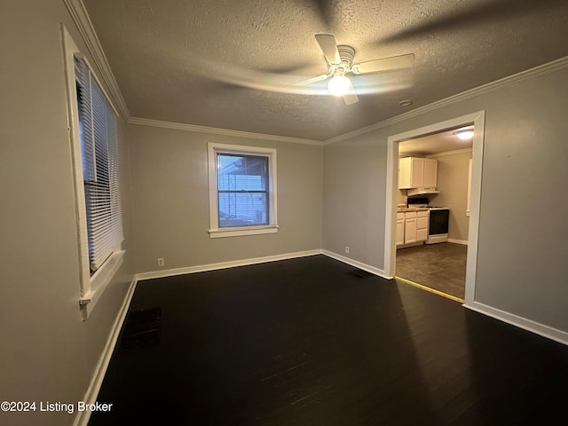 spare room featuring crown molding, dark hardwood / wood-style flooring, ceiling fan, and a textured ceiling