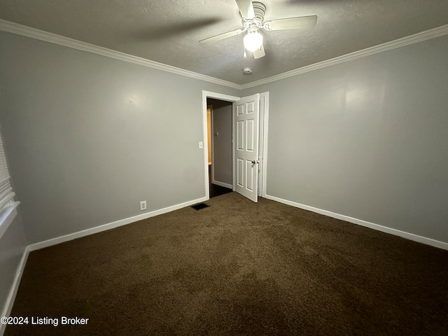 carpeted empty room with ceiling fan, a textured ceiling, and ornamental molding