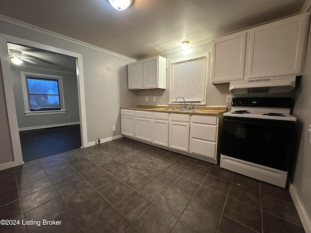 kitchen with dark tile patterned flooring, sink, ceiling fan, white electric range oven, and white cabinetry