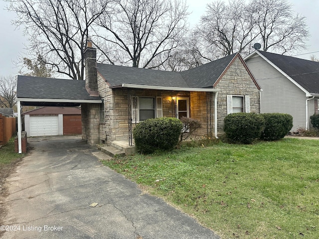 single story home featuring a front lawn