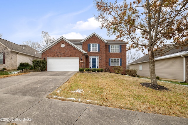 front of property with a garage and a front lawn