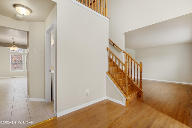 stairs with wood-type flooring