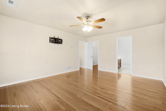 spare room featuring ceiling fan and light hardwood / wood-style flooring