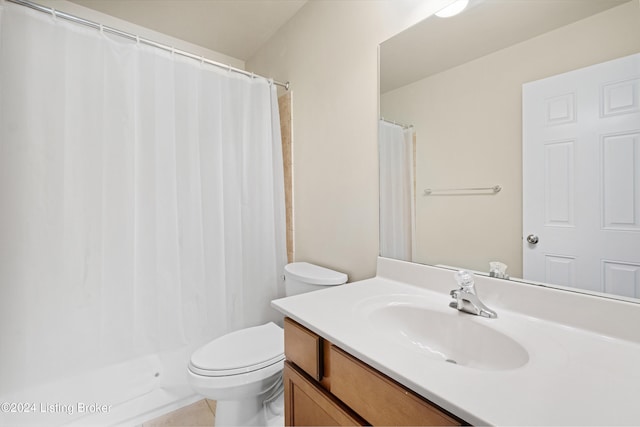 bathroom featuring tile patterned floors, vanity, curtained shower, and toilet