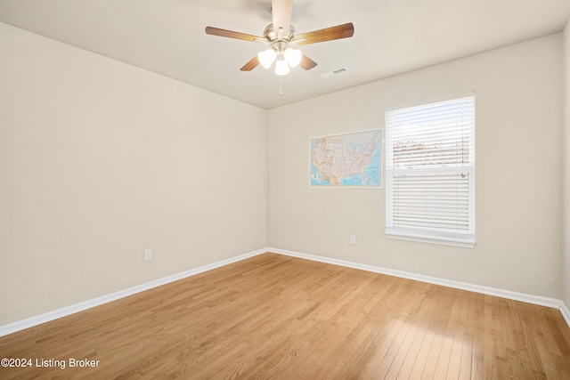 unfurnished room featuring light hardwood / wood-style flooring and ceiling fan