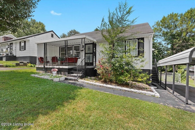 view of front of home featuring covered porch and a front lawn