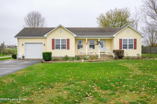 single story home with a garage, covered porch, and a front lawn