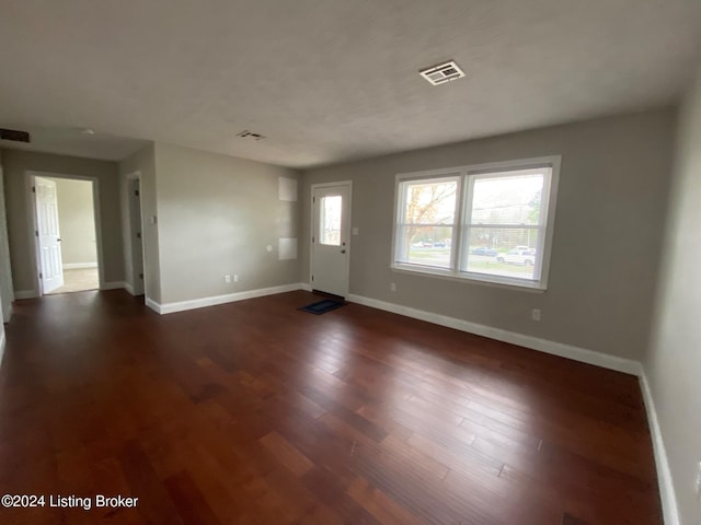 interior space with dark hardwood / wood-style flooring