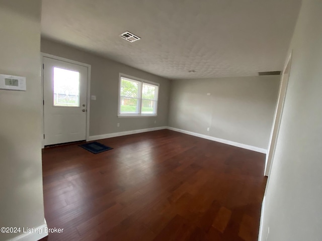 entryway with dark wood-type flooring