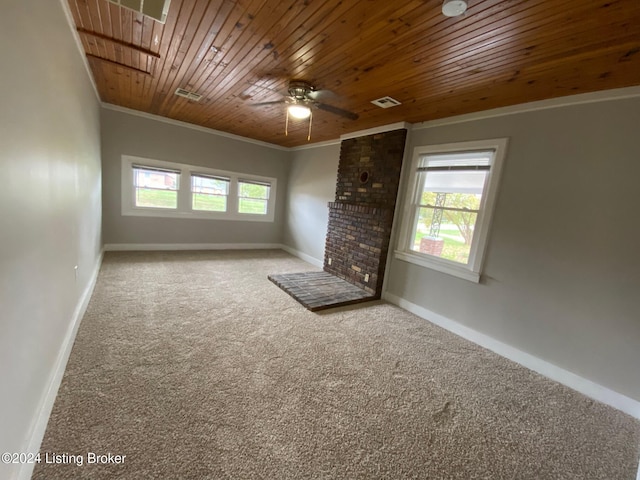 unfurnished living room featuring carpet floors, a wealth of natural light, and wooden ceiling