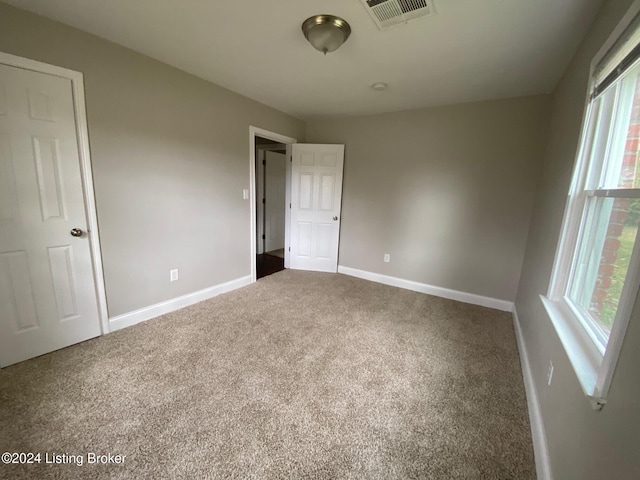 unfurnished bedroom with carpet