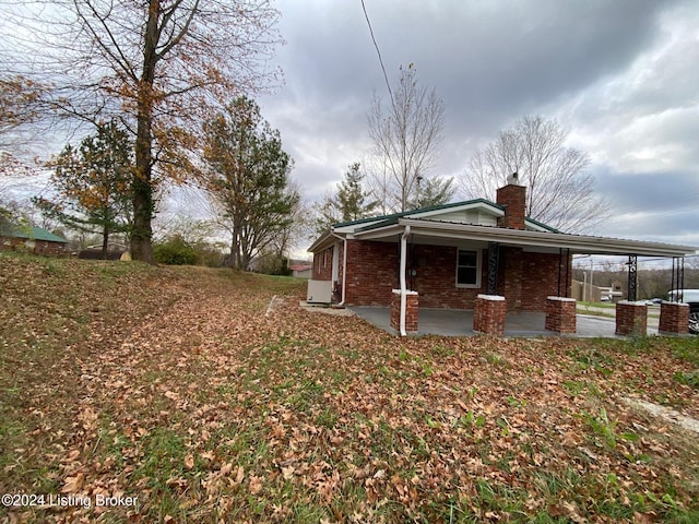 view of side of home featuring a patio