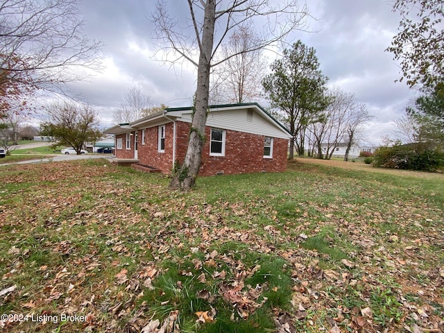 view of property exterior featuring a lawn