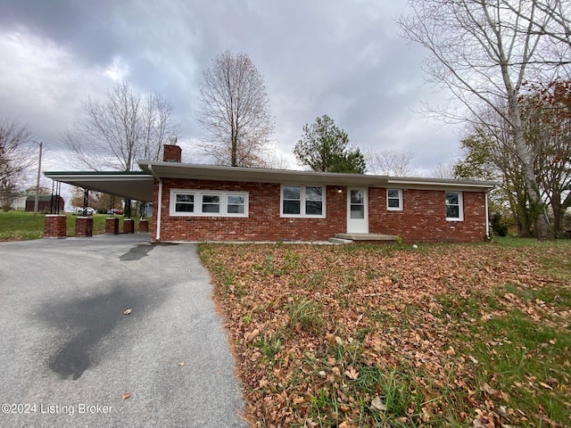 single story home with a carport