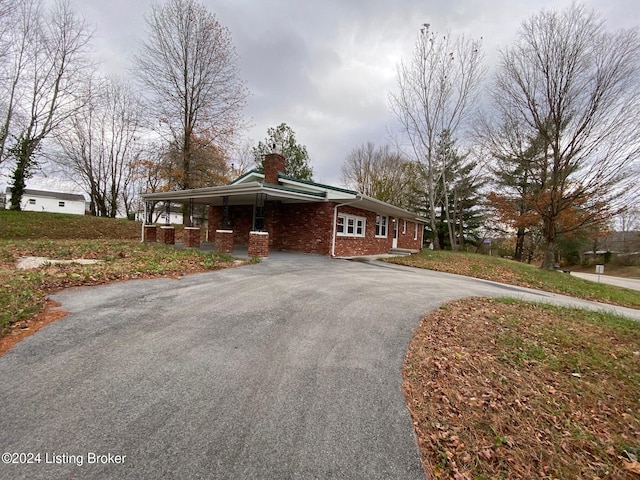 view of front of home with a carport