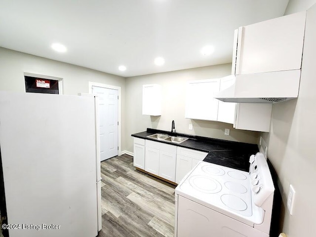 kitchen with white appliances, sink, light hardwood / wood-style flooring, white cabinetry, and range hood