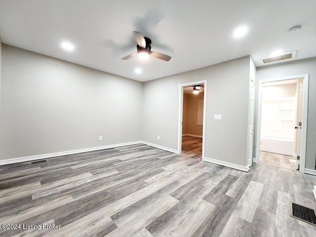 spare room featuring light hardwood / wood-style floors