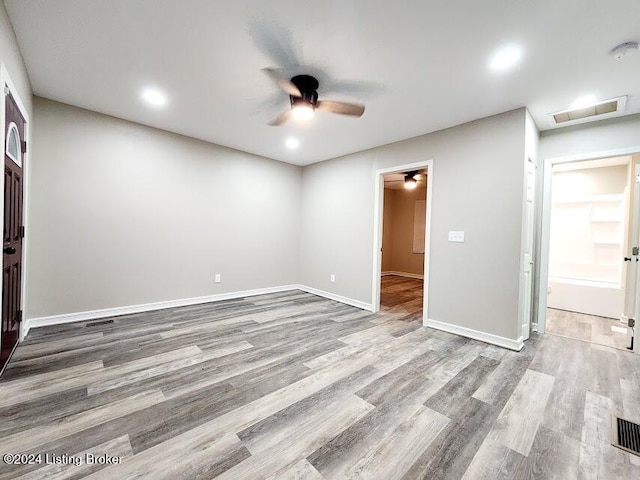 spare room with light hardwood / wood-style flooring