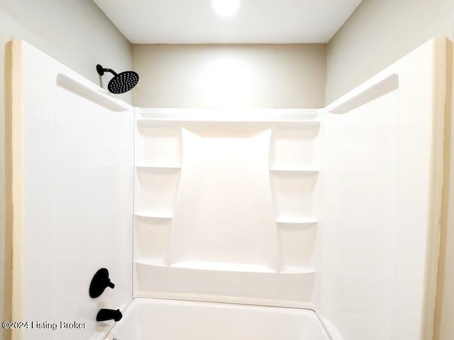 bathroom with shower / washtub combination