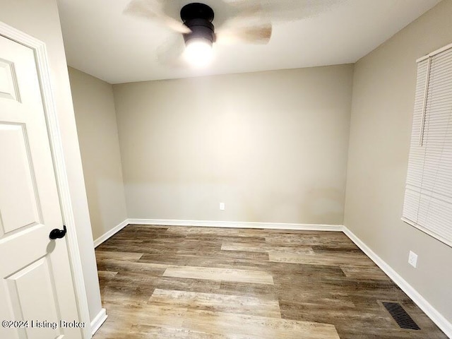 empty room with ceiling fan and wood-type flooring