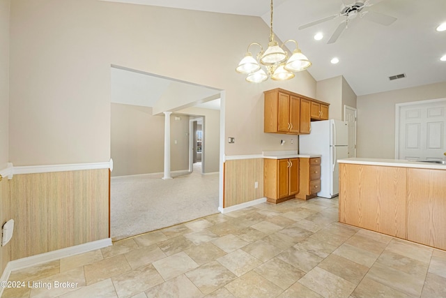 kitchen featuring light carpet, high vaulted ceiling, ceiling fan with notable chandelier, ornate columns, and white fridge