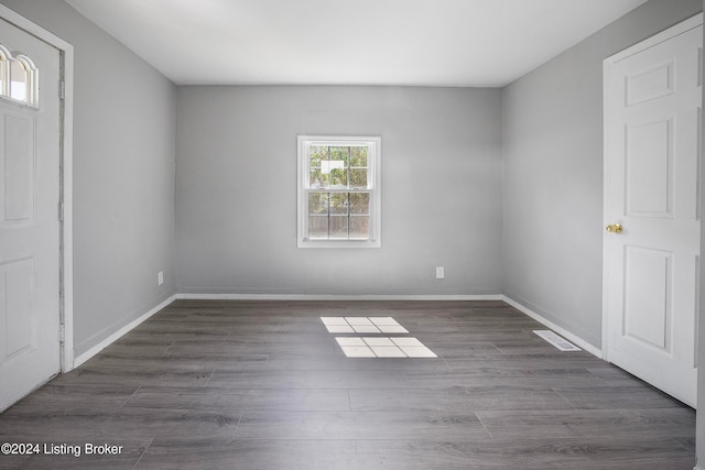 spare room featuring dark hardwood / wood-style floors