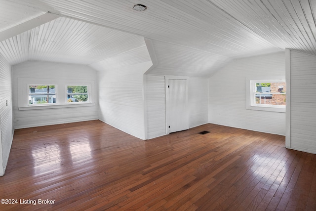 additional living space with dark hardwood / wood-style floors, lofted ceiling, and wooden ceiling