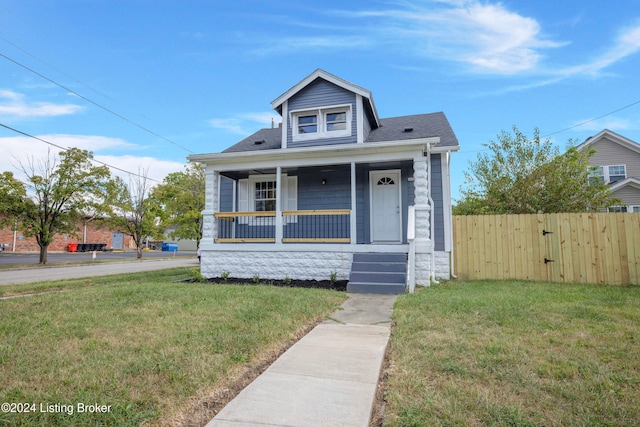 bungalow-style house featuring a front yard and a porch