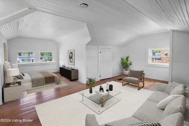 bedroom featuring hardwood / wood-style flooring, lofted ceiling, wood ceiling, and multiple windows