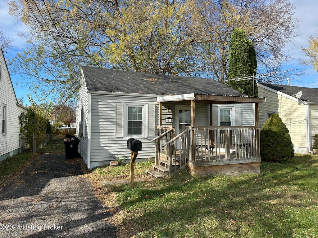 bungalow with a front yard