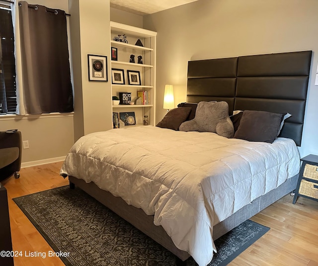 bedroom featuring wood-type flooring