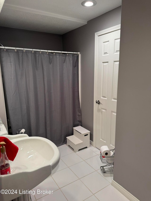 bathroom featuring tile patterned flooring