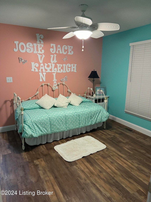 bedroom featuring ceiling fan and wood-type flooring