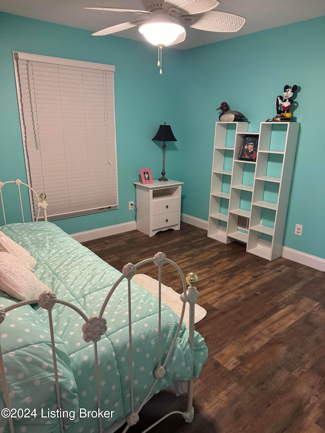 bedroom with ceiling fan and dark wood-type flooring