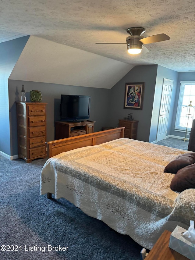 carpeted bedroom with ceiling fan, a textured ceiling, and vaulted ceiling