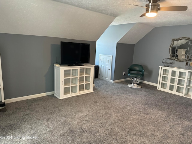 bonus room featuring lofted ceiling, carpet floors, and a textured ceiling