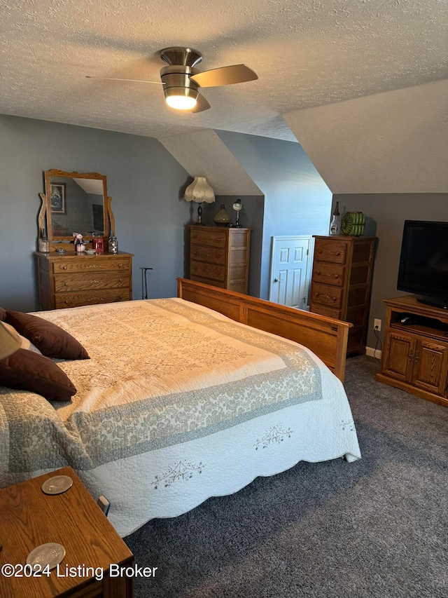 bedroom featuring ceiling fan, carpet floors, a textured ceiling, and vaulted ceiling